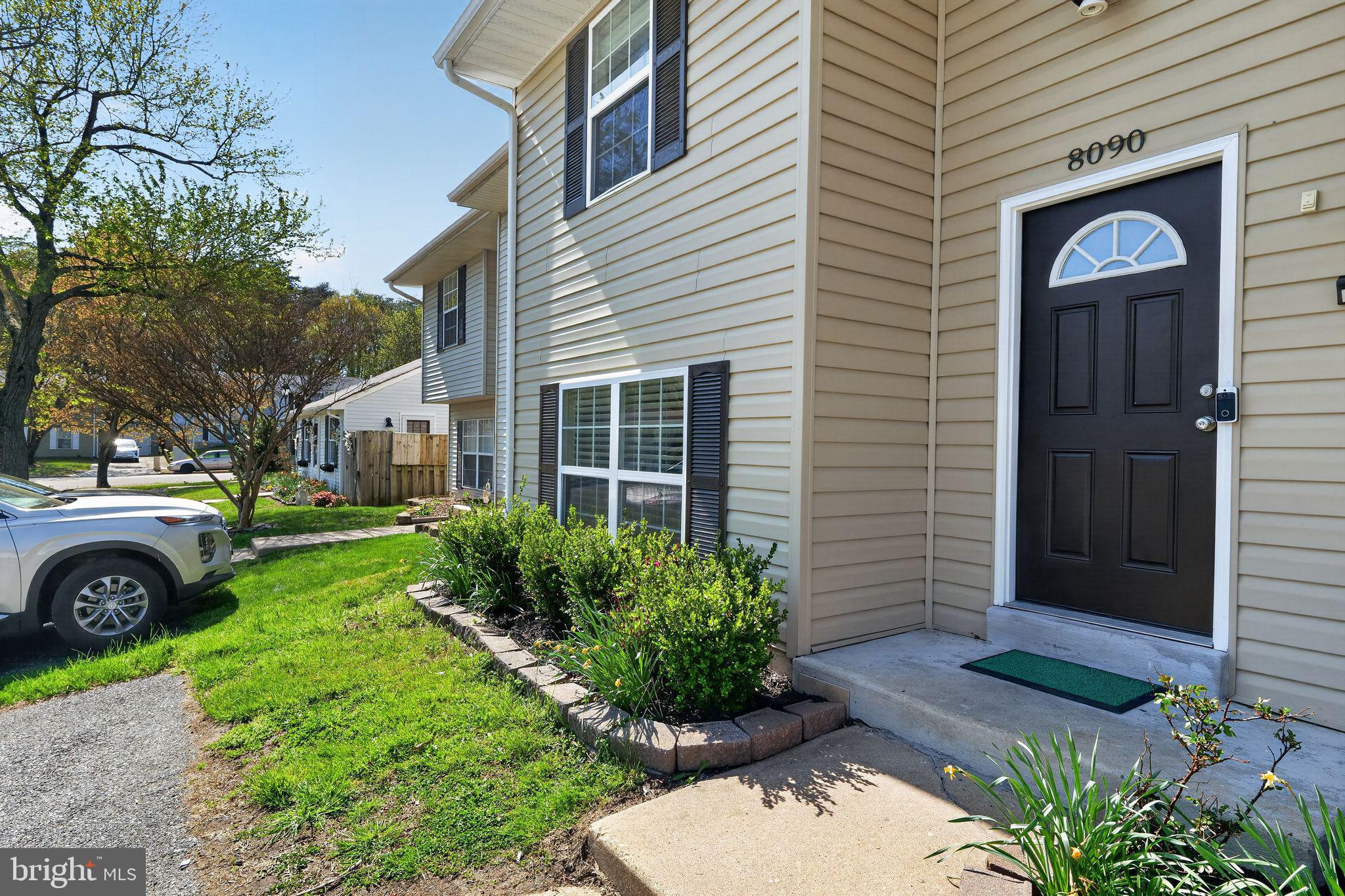 8090 Round Table Court Pasadena, MD 21122 - Photo 3 of 31 a front view of a house with garden