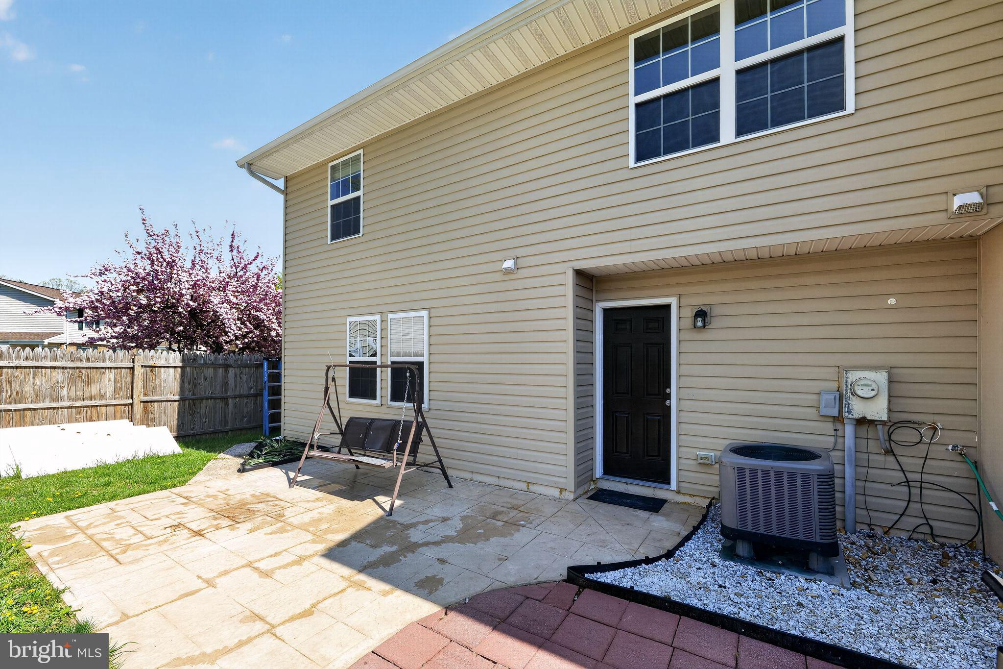 8090 Round Table Court Pasadena, MD 21122 - Photo 4 of 31 a view of a house with backyard and sitting area