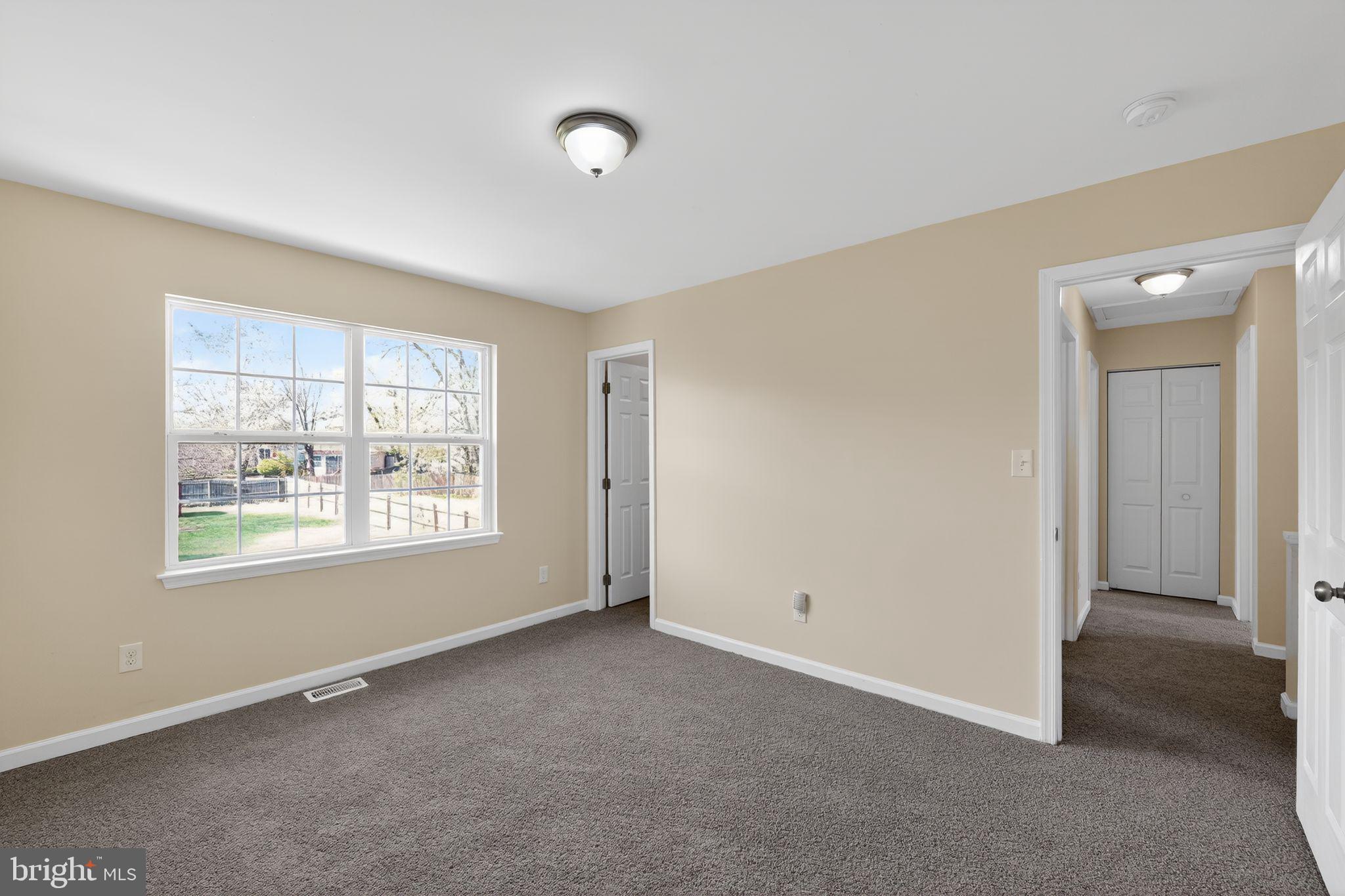 8090 Round Table Court Pasadena, MD 21122 - Photo 8 of 31 an empty room with windows
