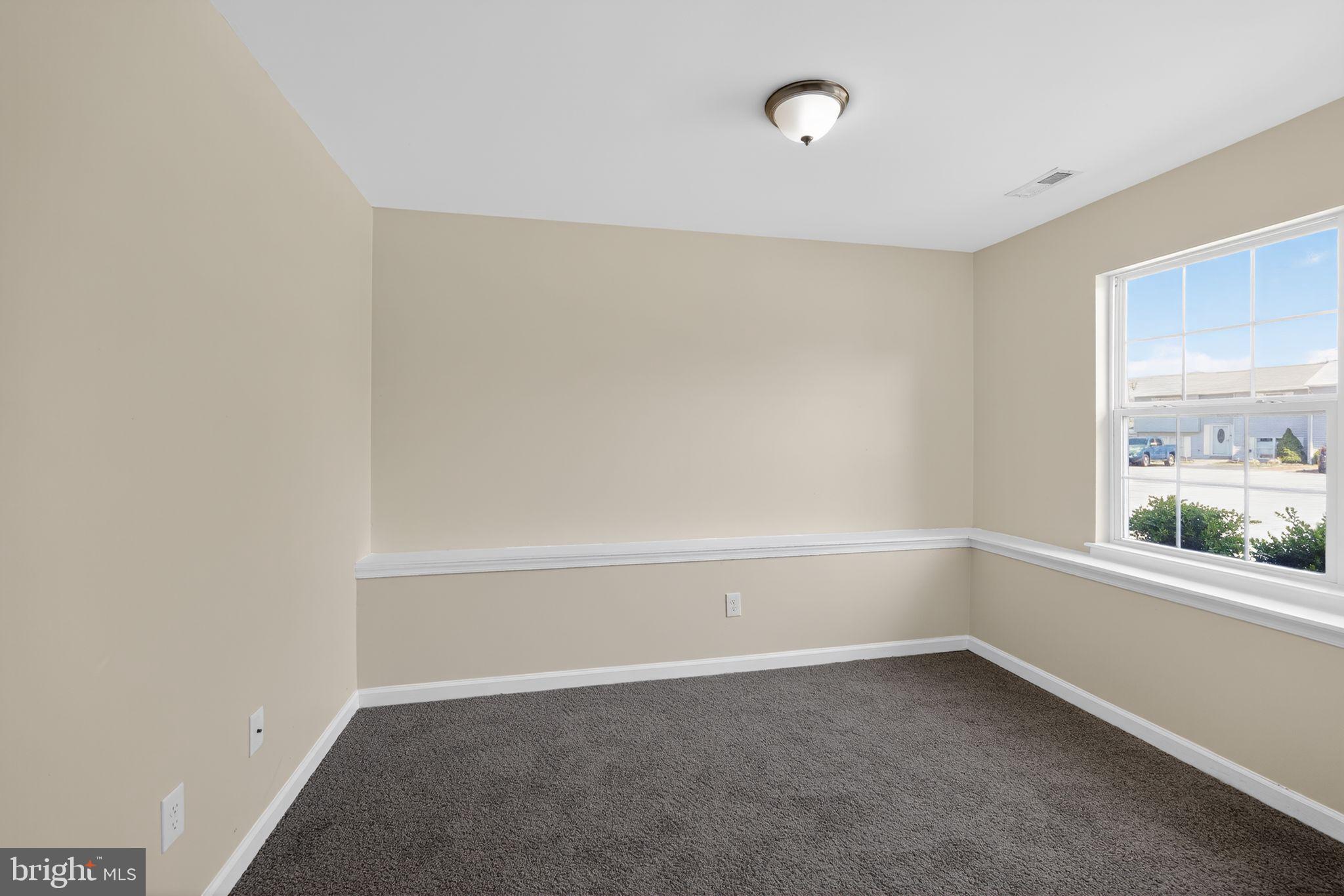 8090 Round Table Court Pasadena, MD 21122 - Photo 9 of 31 a view of an empty room with a window
