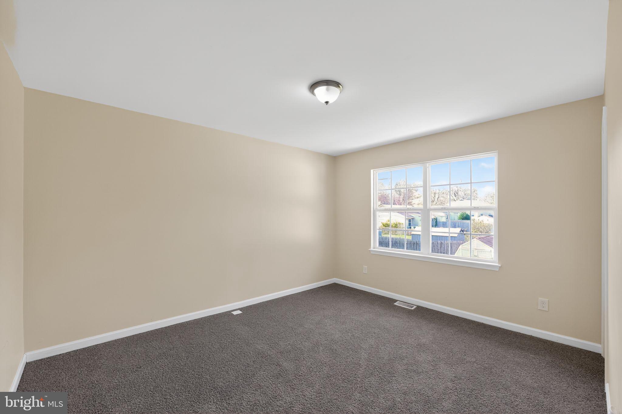 8090 Round Table Court Pasadena, MD 21122 - Photo 10 of 31 an empty room with a window