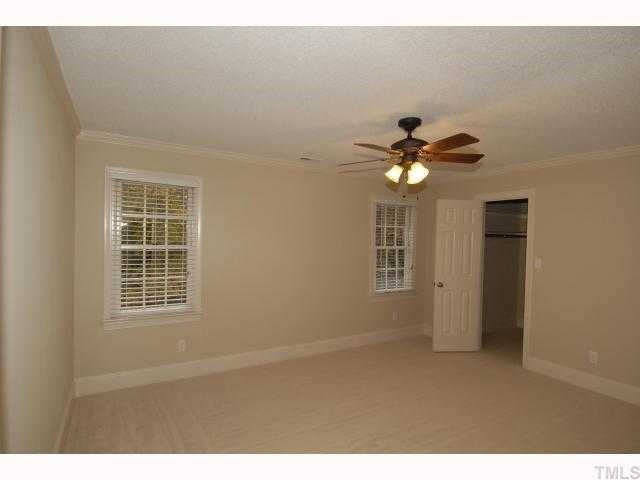 5229 Caber Road Raleigh, NC 27613 - Photo 11 of 12 Large bedrooms with walk in closets. New Hunter cieling fans and each bedroom has two large windows. Bedroom