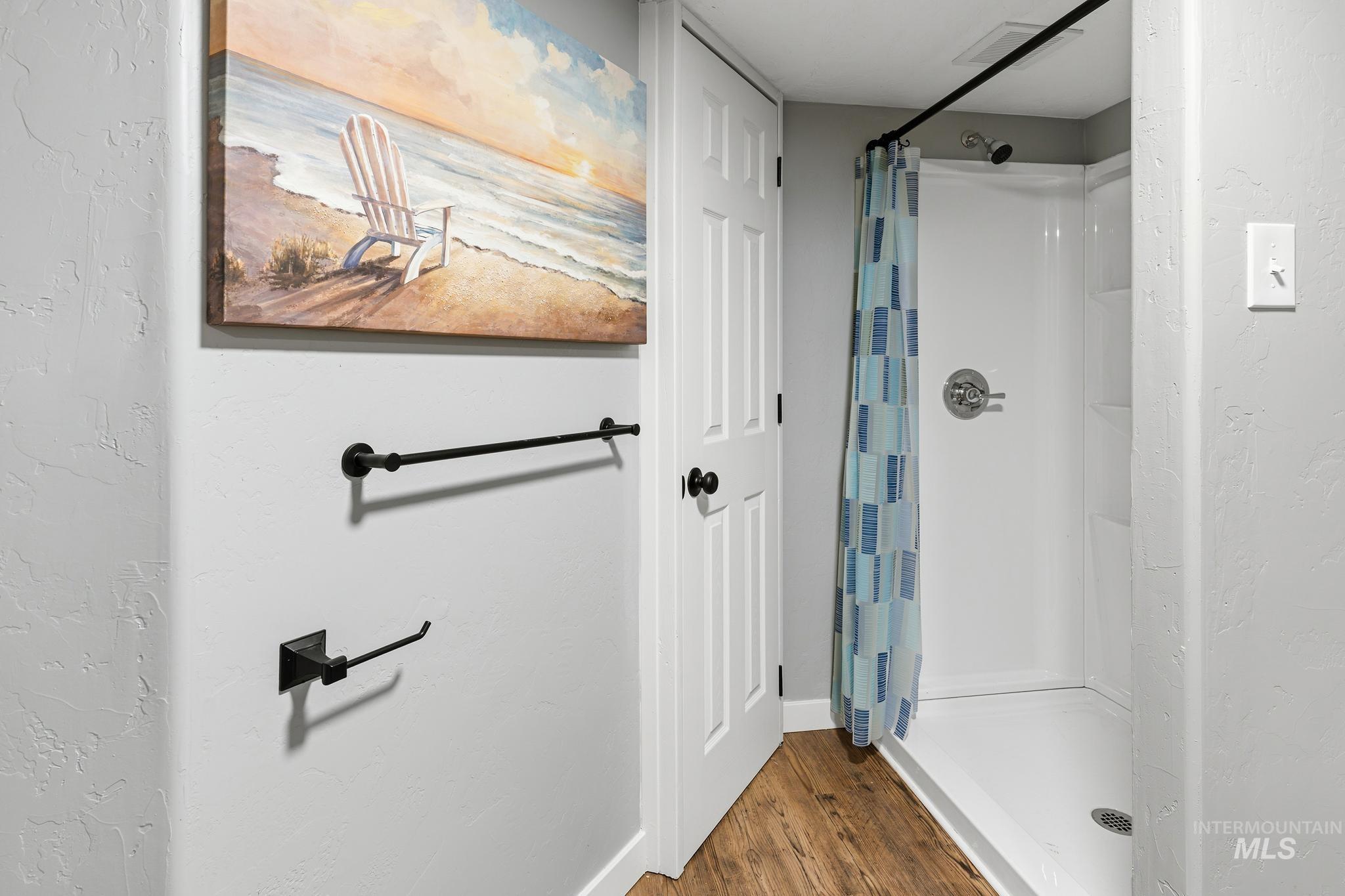 619 Thain Road Lewiston, ID 83501 - Photo 10 of 44 Walk-in shower with a chrome fixture and white surround