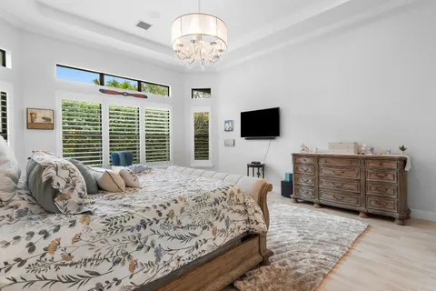 a bedroom with a large bed and a window