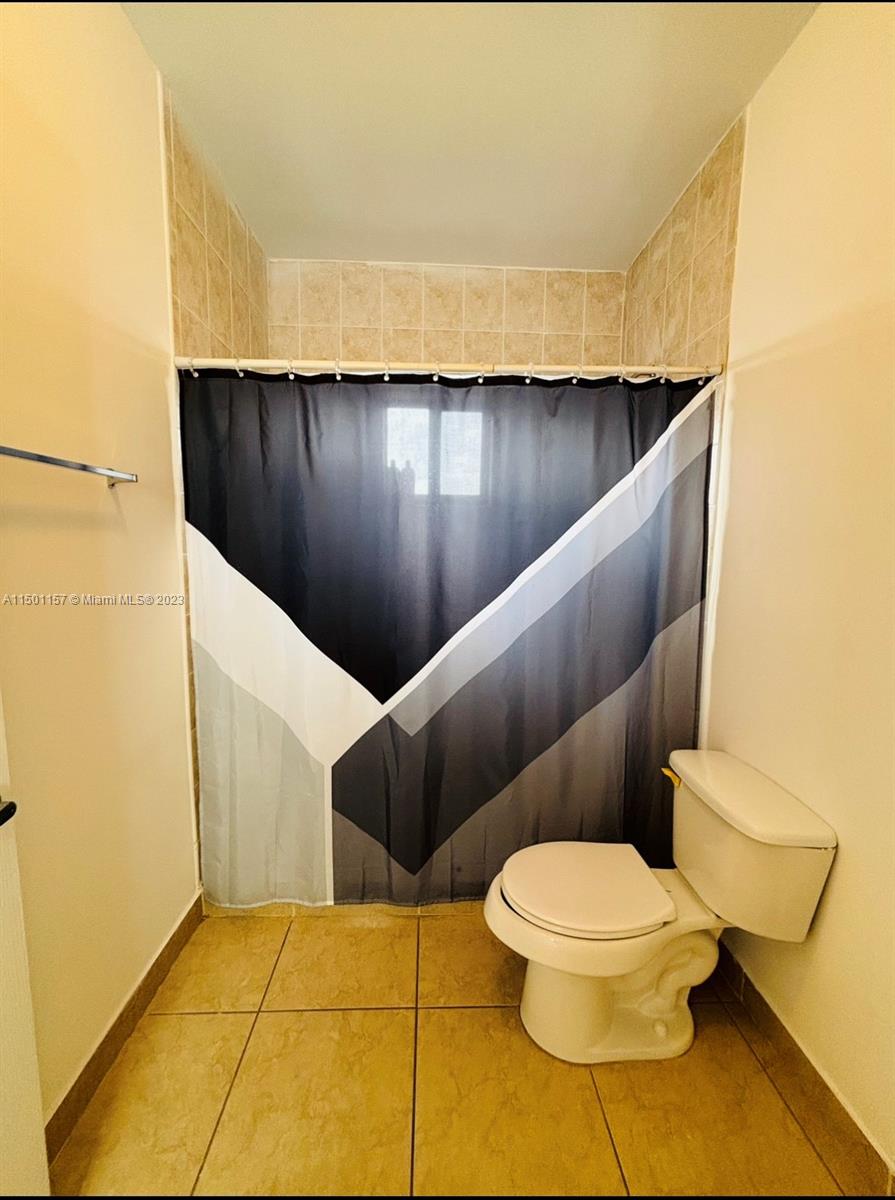 11115 West Okeechobee Road, Unit 181 Hialeah Gardens, FL 33018 - Photo 19 of 31 a bathroom with a toilet
