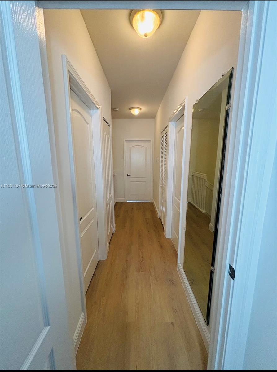 11115 West Okeechobee Road, Unit 181 Hialeah Gardens, FL 33018 - Photo 20 of 31 a view of a hallway