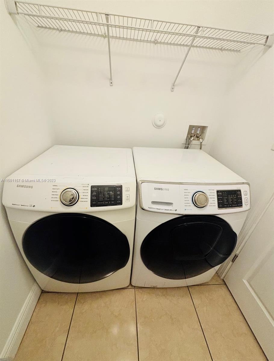 11115 West Okeechobee Road, Unit 181 Hialeah Gardens, FL 33018 - Photo 31 of 31 a utility room with dryer and washer