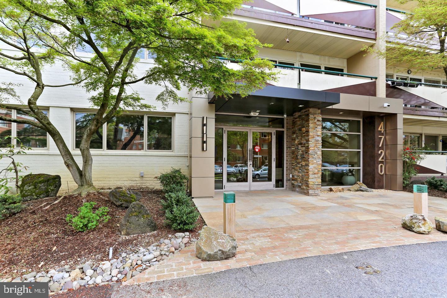 a view of a building with a tree