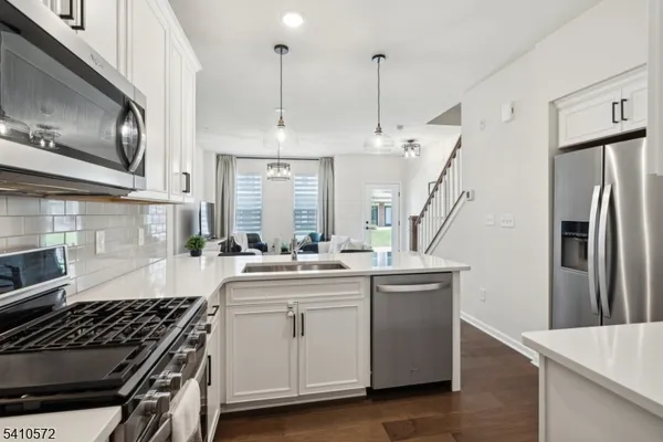 a kitchen with a stove and a refrigerator