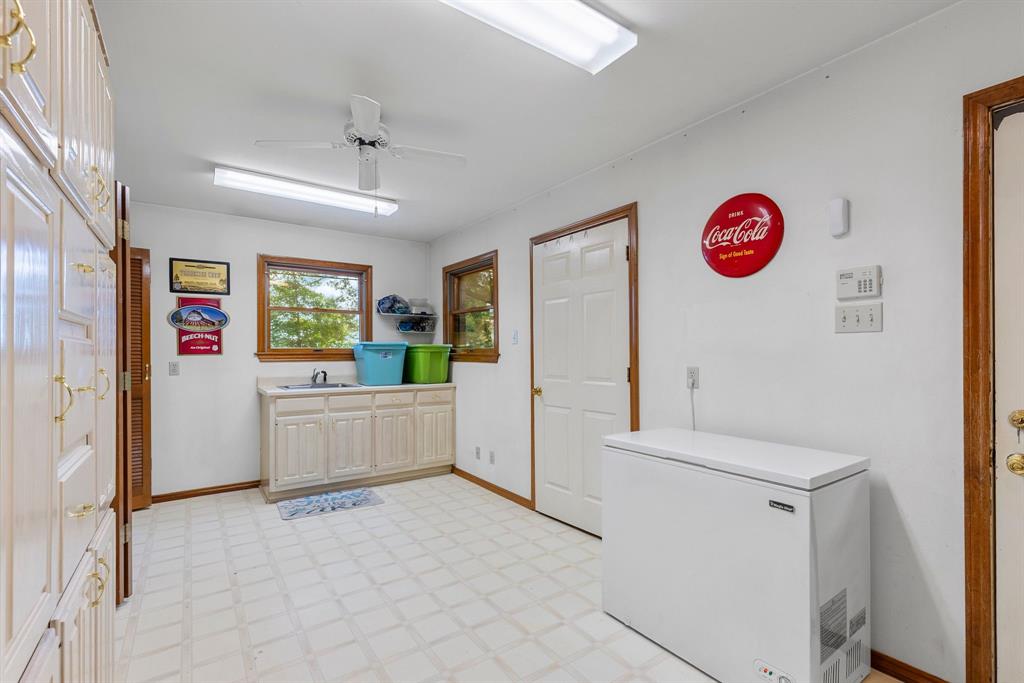 476 Private Road 7326 Emory, TX 75440 - Photo 29 of 33 a view of a kitchen with fridge and window