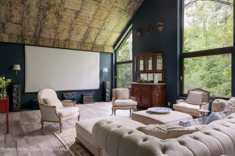 a bedroom with bed or couch and a large window