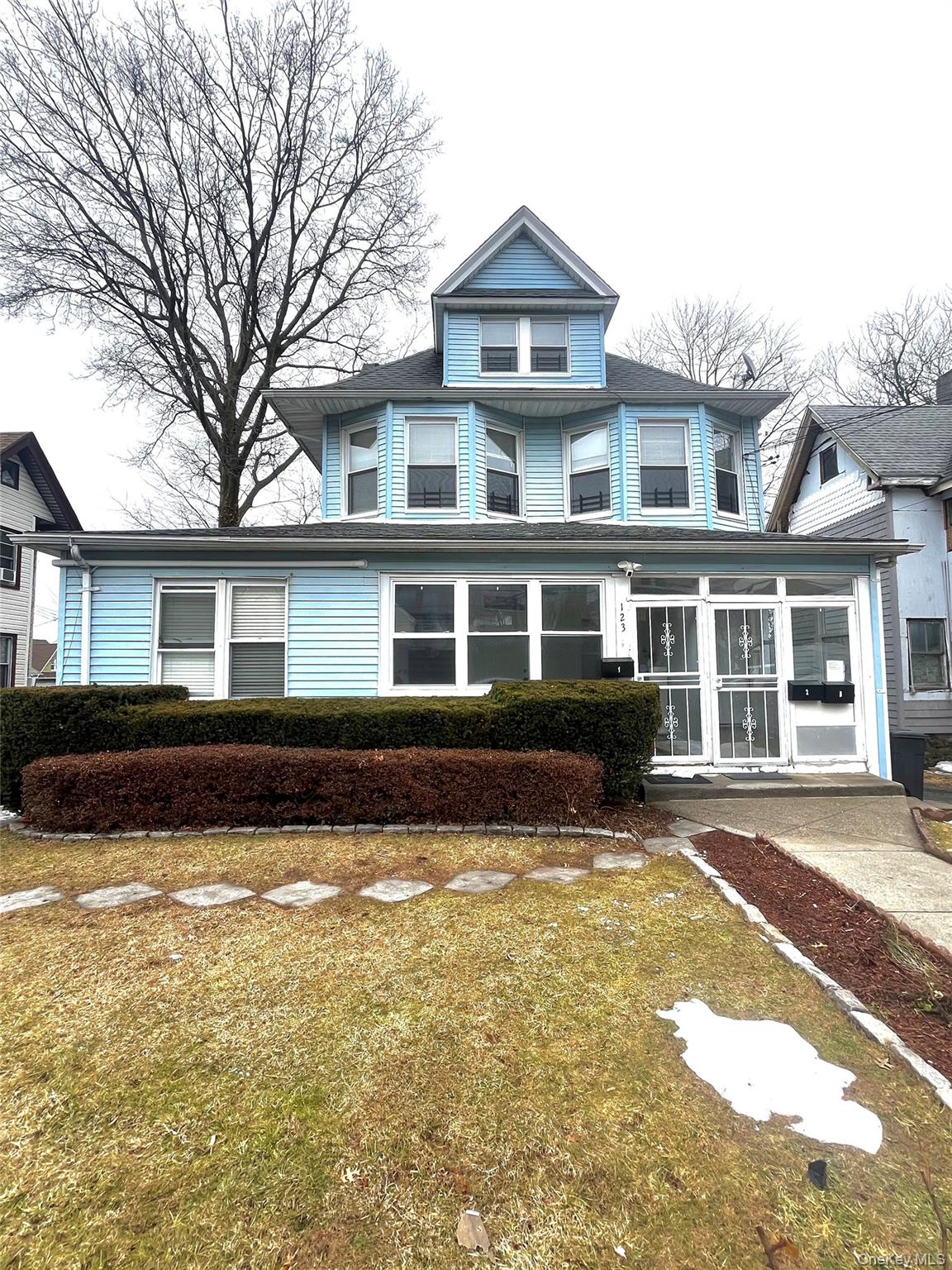 a front view of a house with a yard