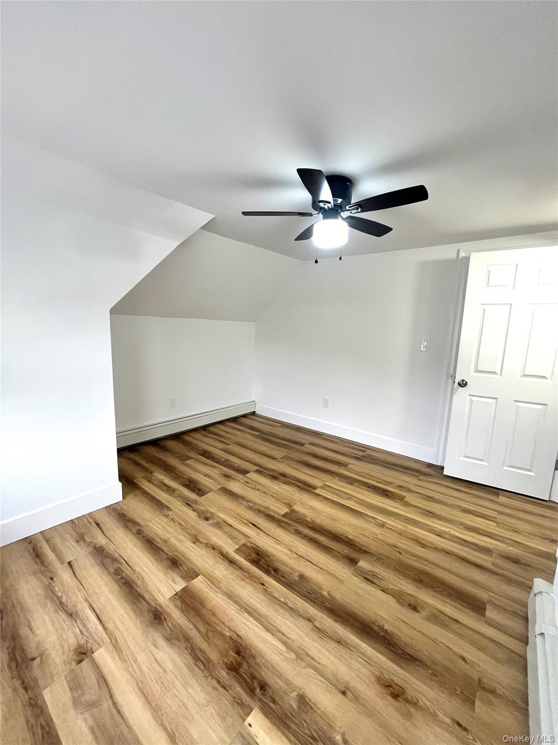 123 Clinton Avenue, Unit 2 New Rochelle, NY 10801 - Photo 15 of 27 a view of empty room with wooden floor