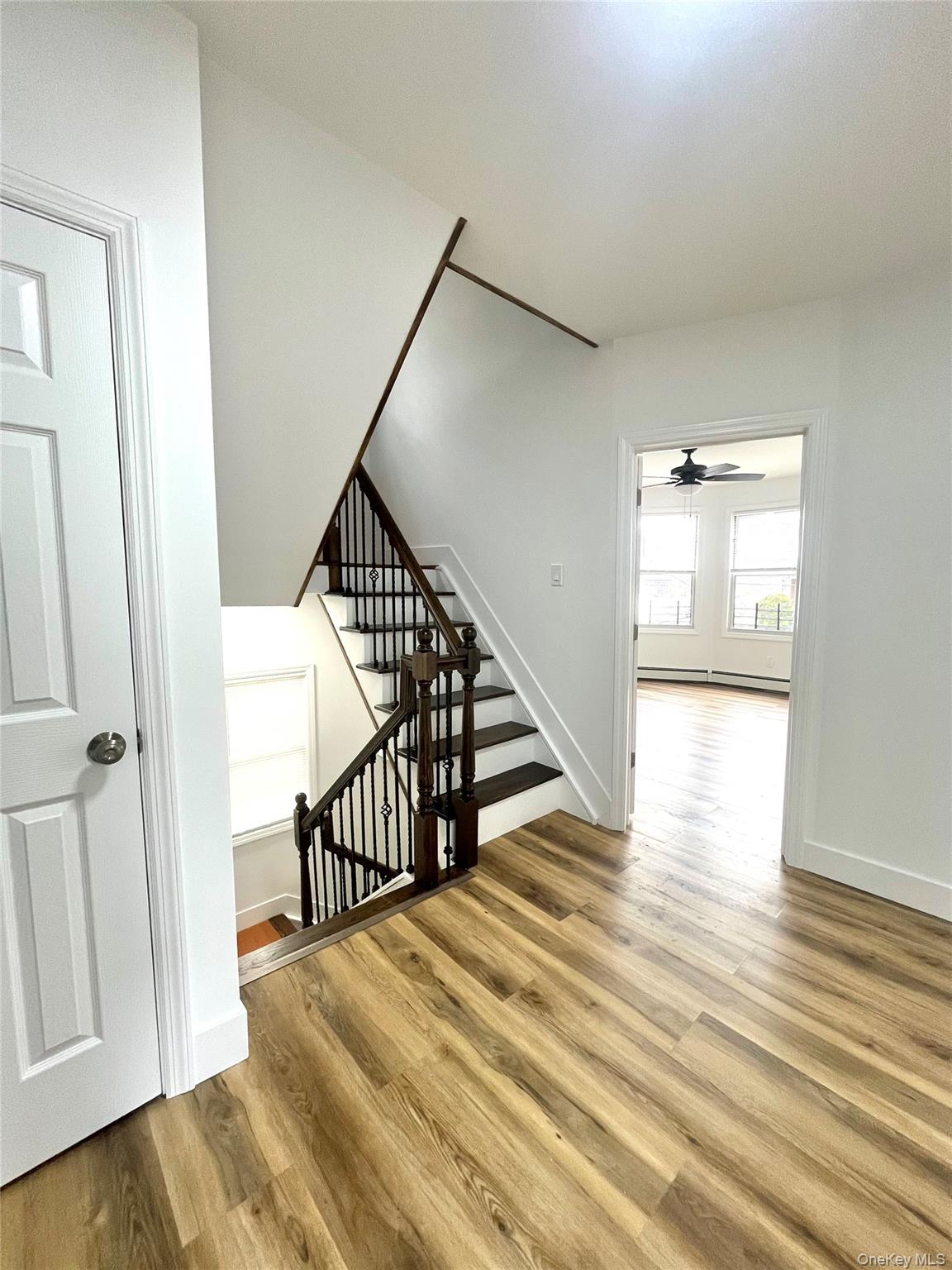 123 Clinton Avenue, Unit 2 New Rochelle, NY 10801 - Photo 6 of 27 a view of a hallway with wooden floor and entryway