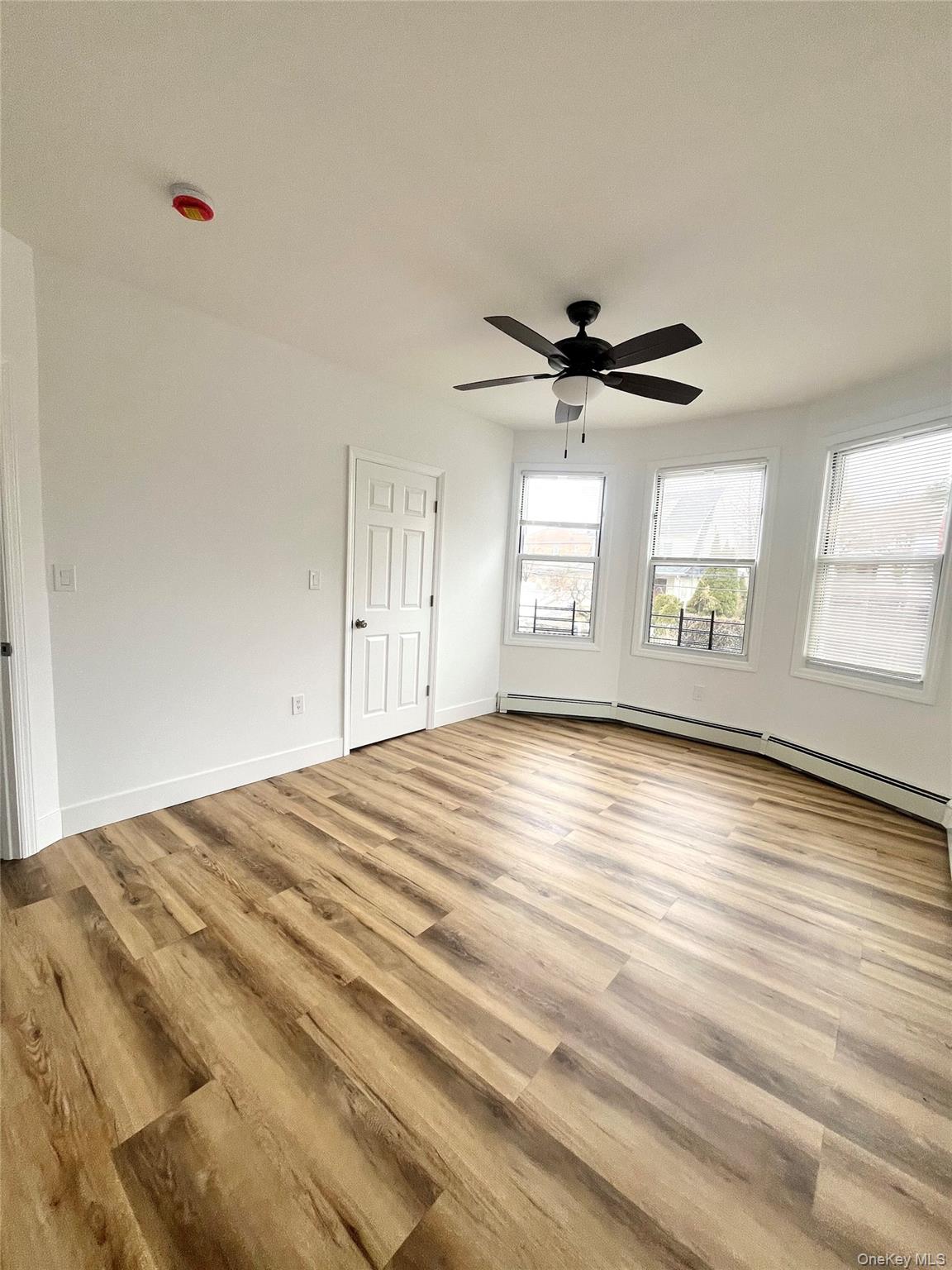 123 Clinton Avenue, Unit 2 New Rochelle, NY 10801 - Photo 8 of 27 a view of an empty room with a window