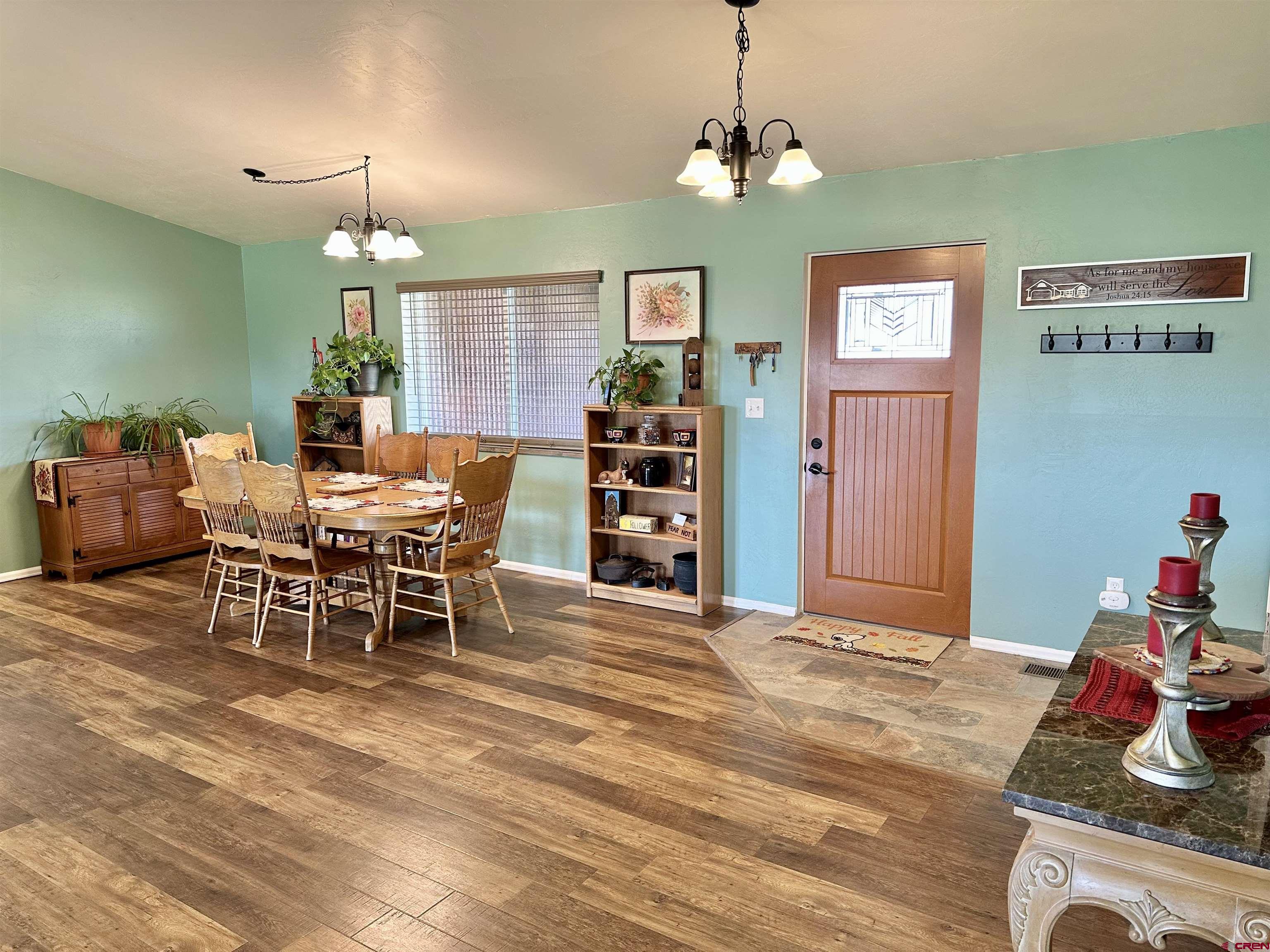 8352 2000th Road Austin, CO 81410 - Photo 11 of 35 a view of a dining room with furniture and chandelier