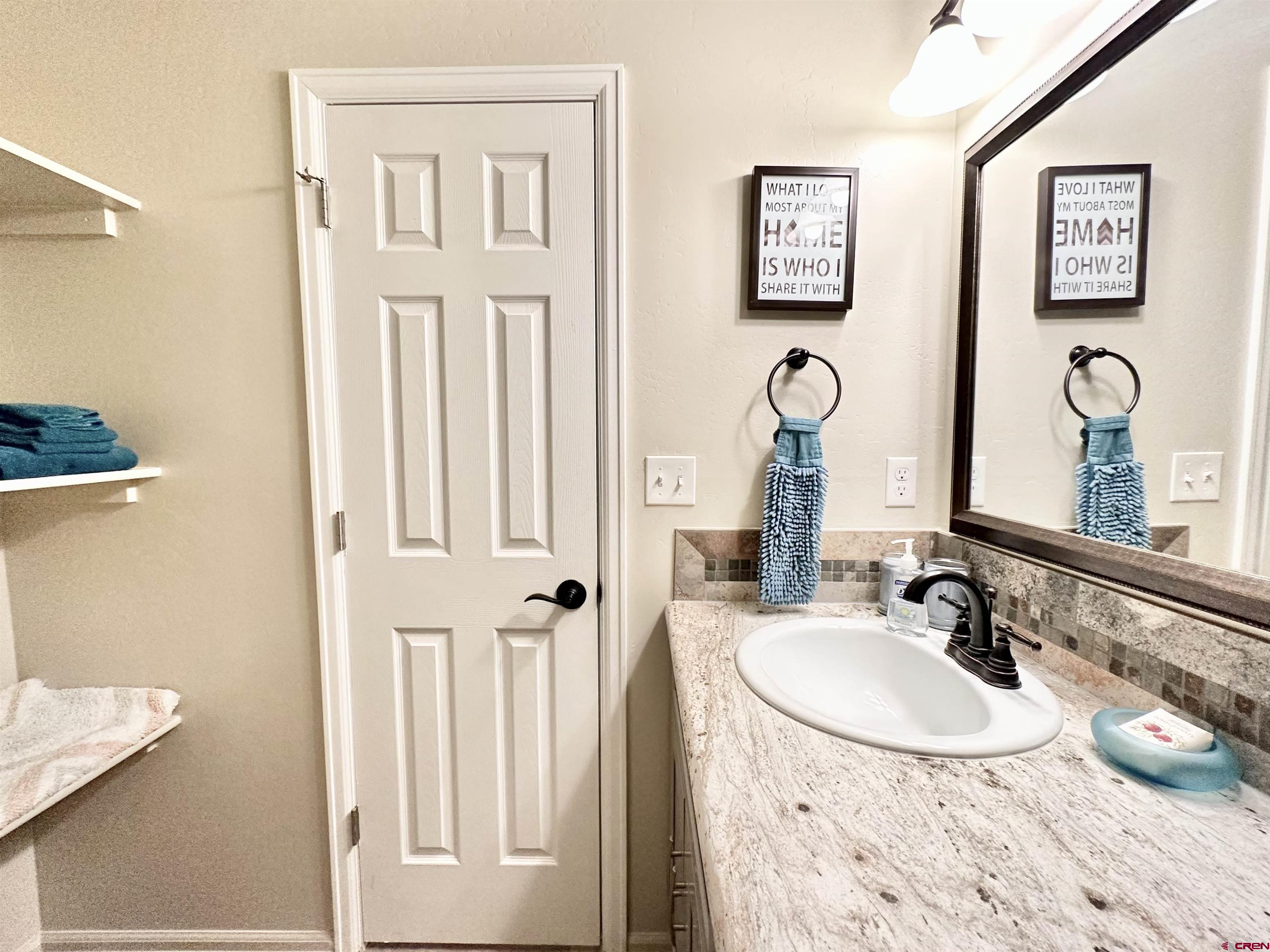8352 2000th Road Austin, CO 81410 - Photo 27 of 35 a bathroom with a sink and a mirror