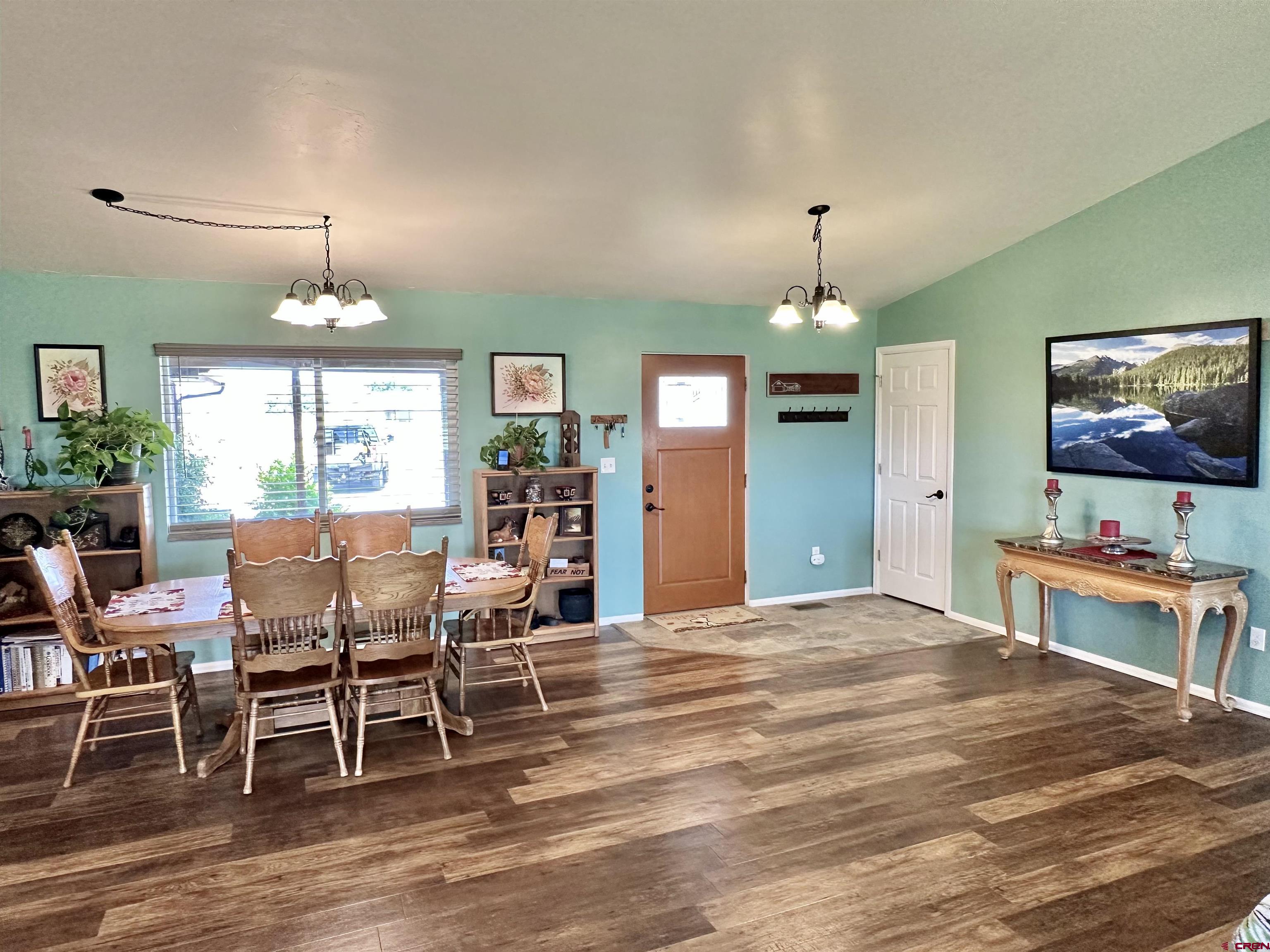 8352 2000th Road Austin, CO 81410 - Photo 10 of 35 a view of a dining room with furniture window and wooden floor