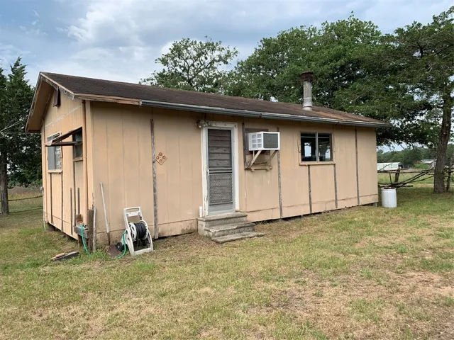 a backyard of a house with lots of green space