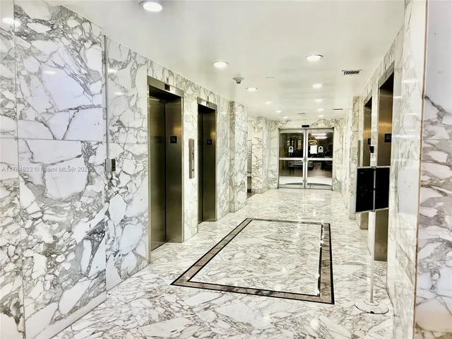a view of a hallway with a white walls