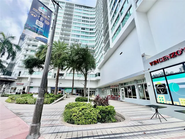 a front view of building with yard