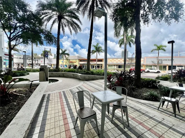 a view of a backyard and swimming pool