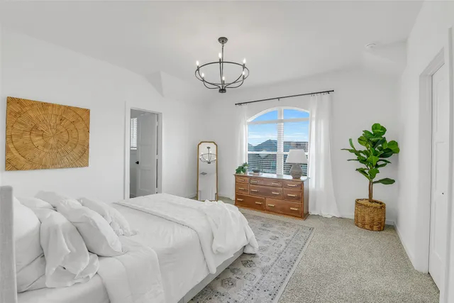 a view of a livingroom with a couch and window