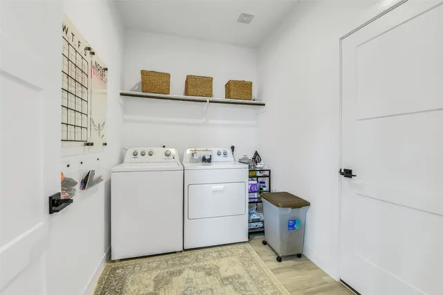 a bathroom with 2 sink and a mirror