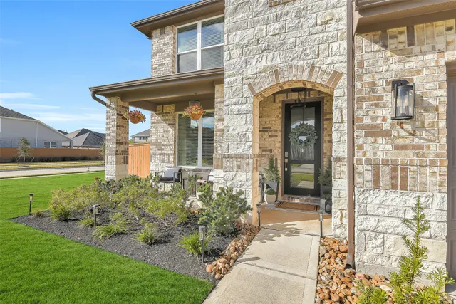a front view of a house with garden
