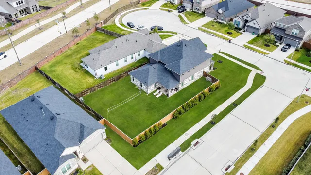 an aerial view of a house with outdoor space