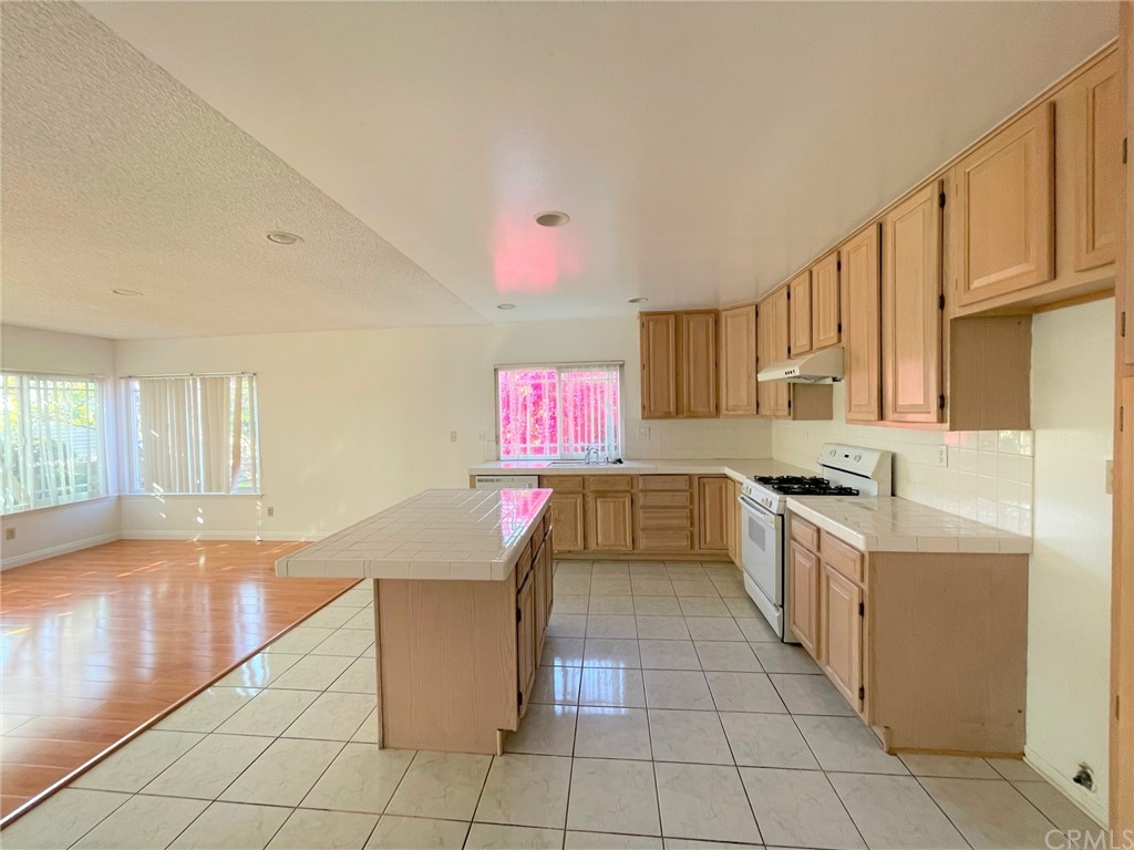 20218 Fuero Drive Walnut, CA 91789 - Photo 3 of 8 a kitchen with stainless steel appliances granite countertop a sink and cabinets