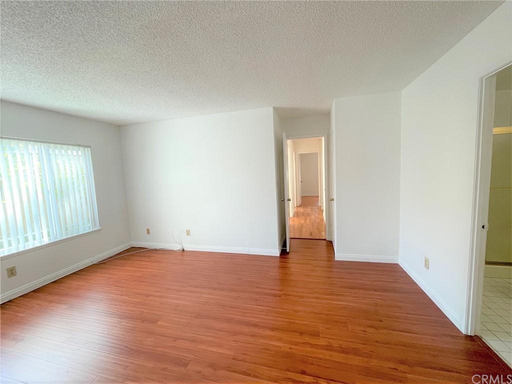 20218 Fuero Drive Walnut, CA 91789 - Photo 5 of 8 an empty room with wooden floor and windows