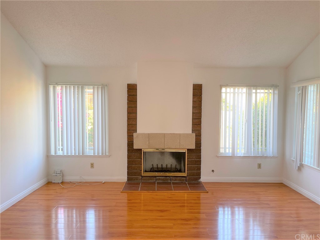20218 Fuero Drive Walnut, CA 91789 - Photo 7 of 8 a view of an empty room with a window and wooden floor
