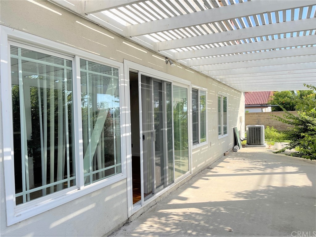 20218 Fuero Drive Walnut, CA 91789 - Photo 8 of 8 a view of a porch with a glass door and glass door