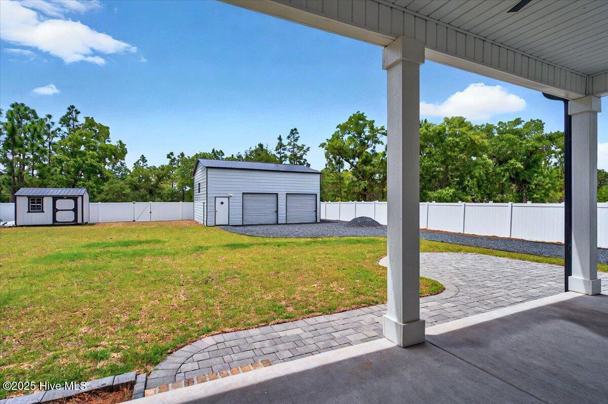 550 Barber Road Southport, NC 28461 - Photo 33 of 64 Back Porch overlooking yard and garage