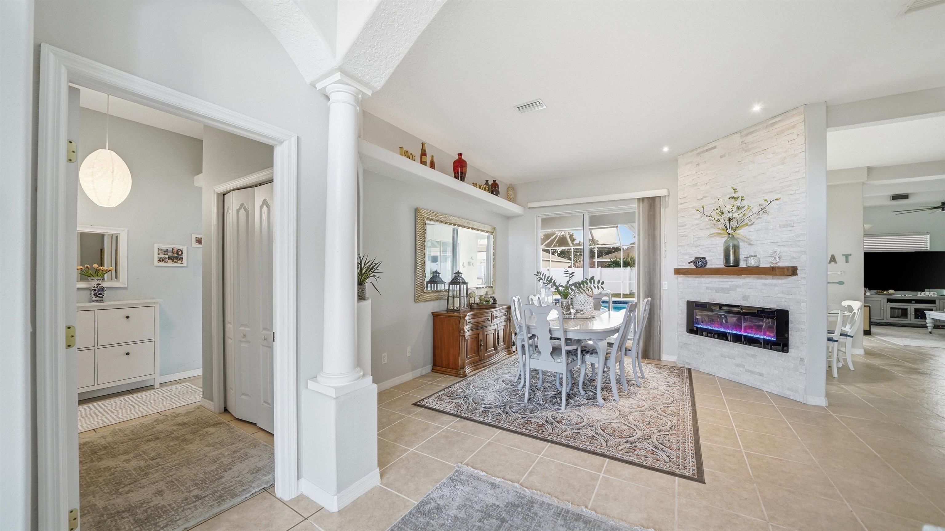 22 Flanders Lane Palm Coast, FL 32137 - Photo 11 of 70 a living room with furniture and a fireplace