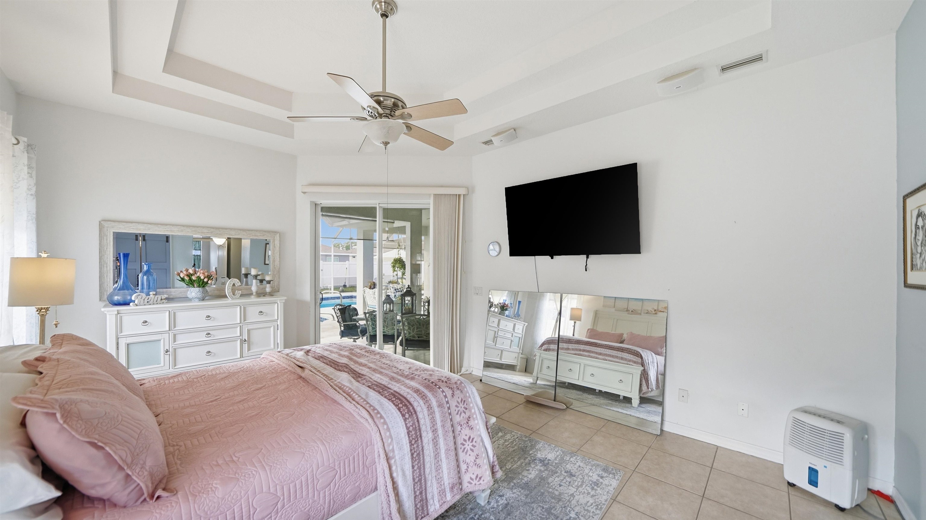 22 Flanders Lane Palm Coast, FL 32137 - Photo 15 of 70 a bedroom with a bed and a flat screen tv