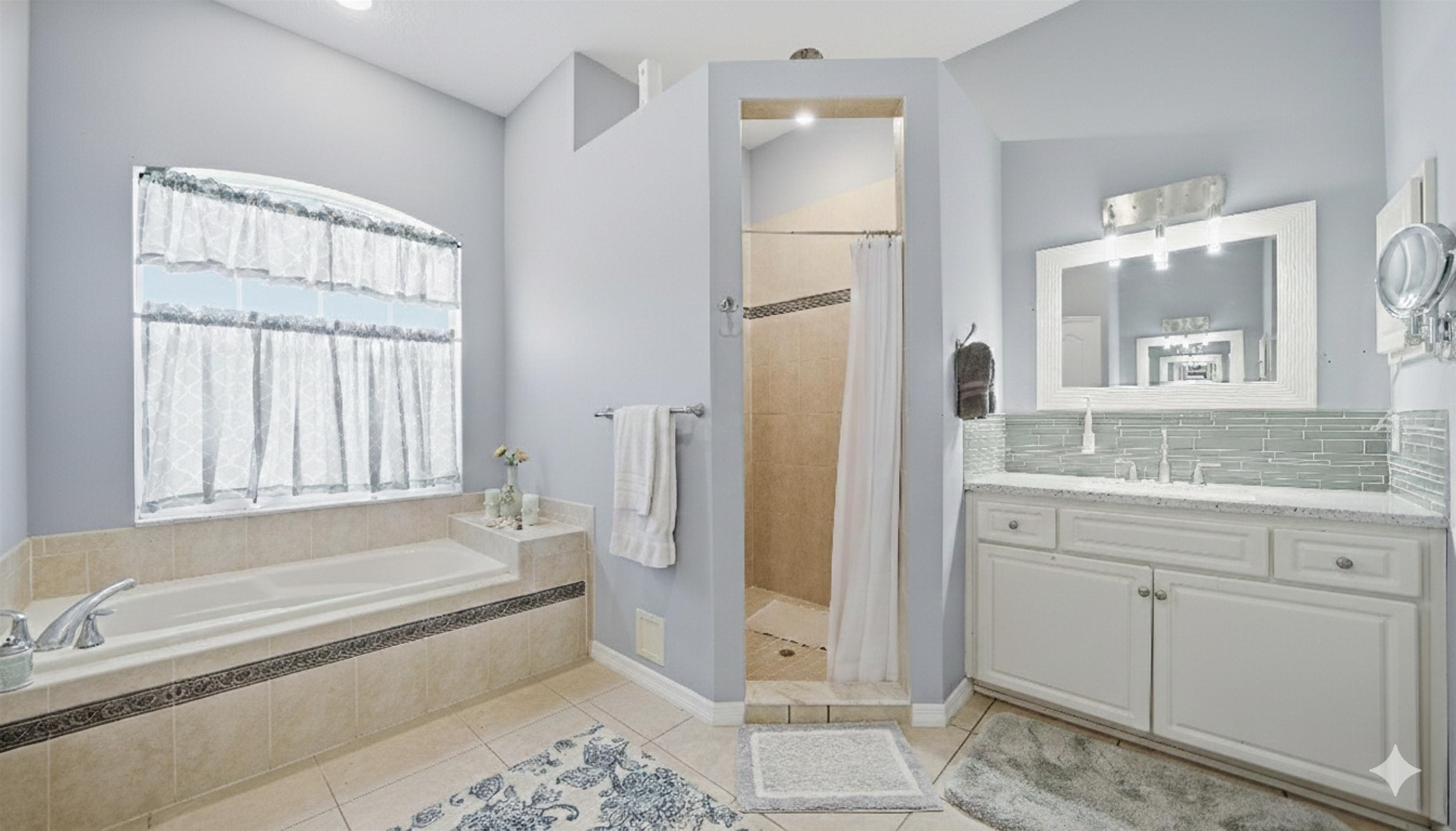 22 Flanders Lane Palm Coast, FL 32137 - Photo 17 of 70 a bathroom with a granite countertop bathtub shower and sink