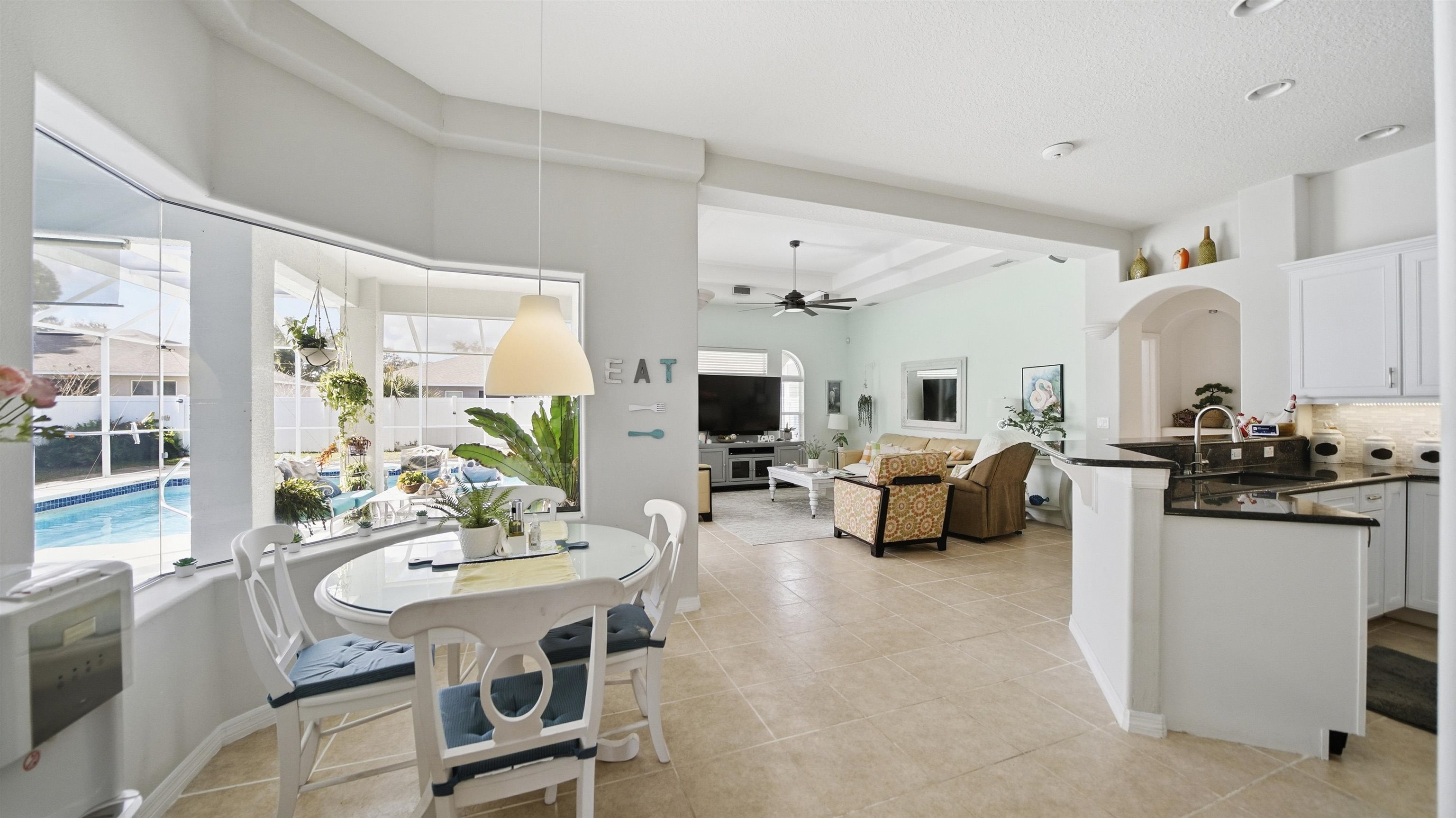 22 Flanders Lane Palm Coast, FL 32137 - Photo 25 of 70 a living room with furniture and a table