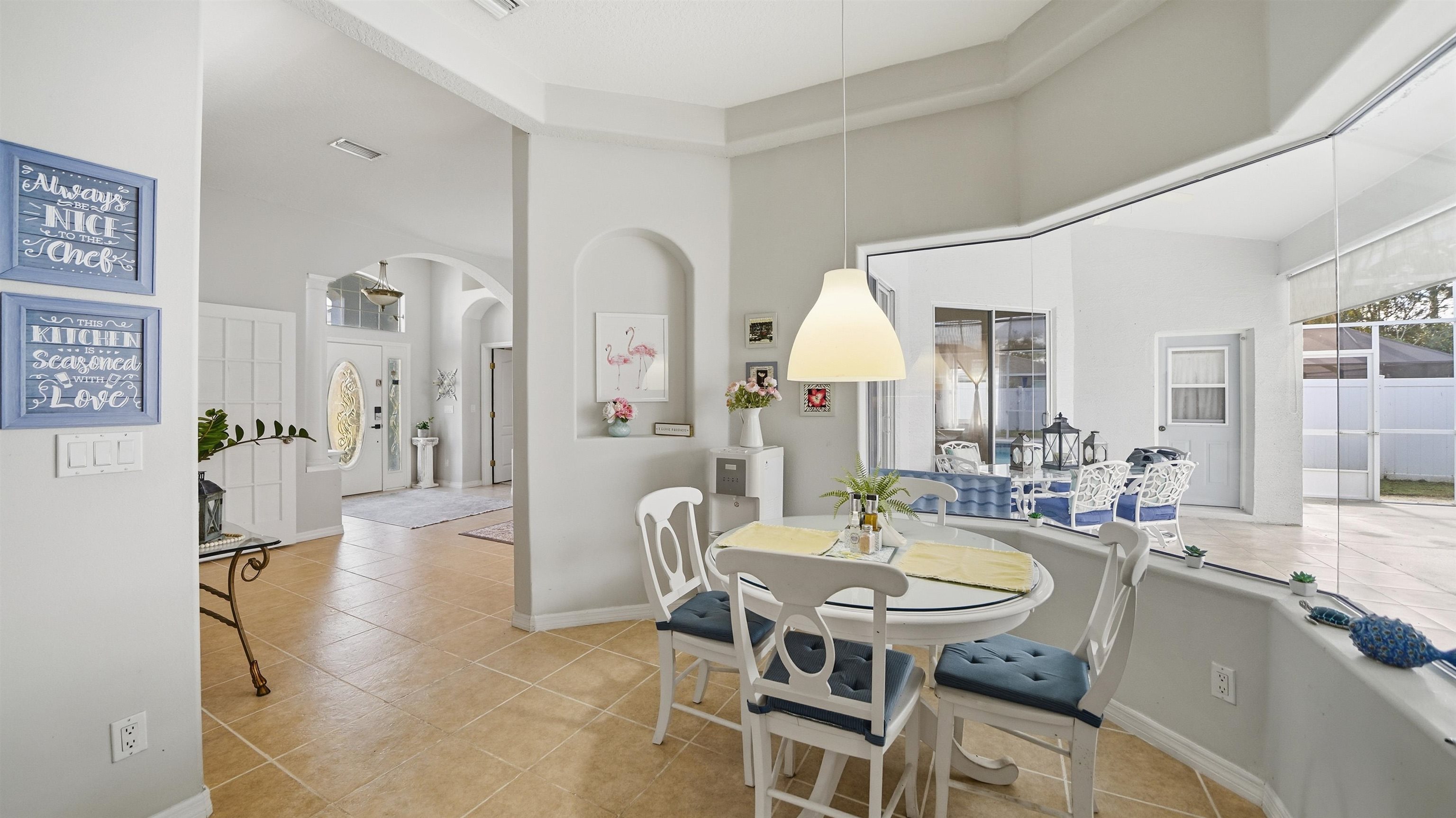 22 Flanders Lane Palm Coast, FL 32137 - Photo 26 of 70 a view of a dining room with furniture and a livingroom