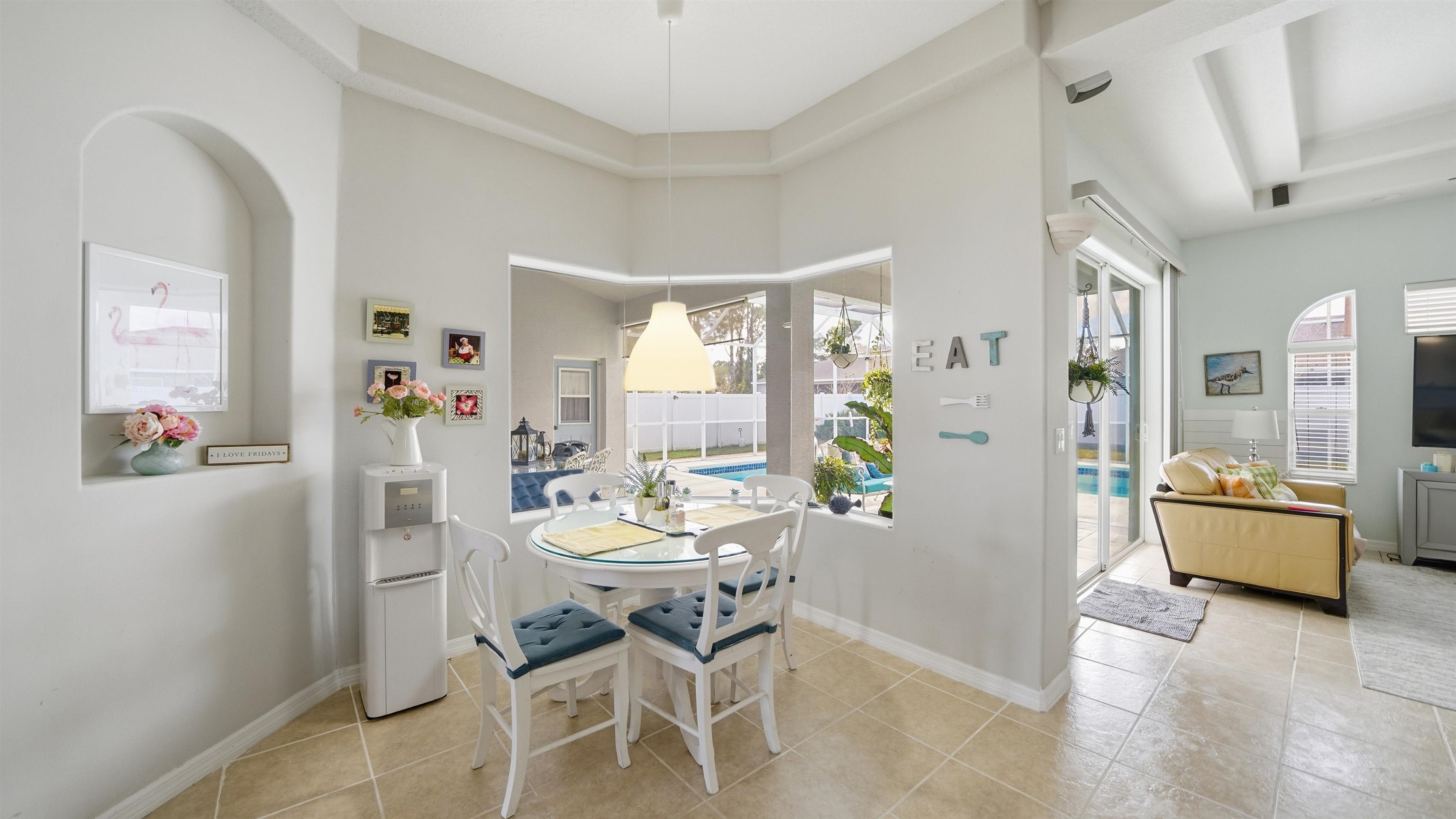 22 Flanders Lane Palm Coast, FL 32137 - Photo 27 of 70 a dining room with furniture and large windows