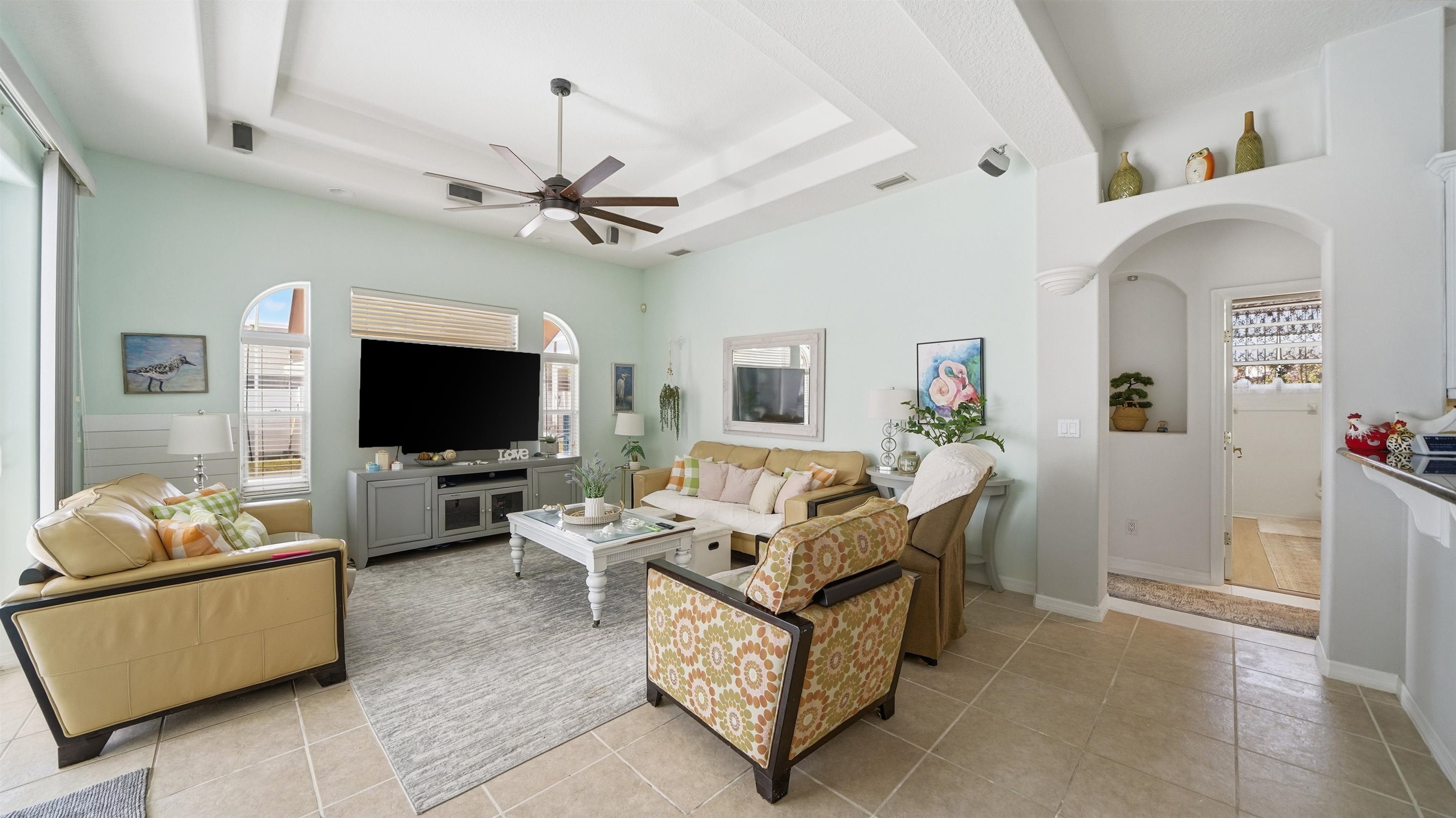 22 Flanders Lane Palm Coast, FL 32137 - Photo 35 of 70 a living room with furniture and a flat screen tv