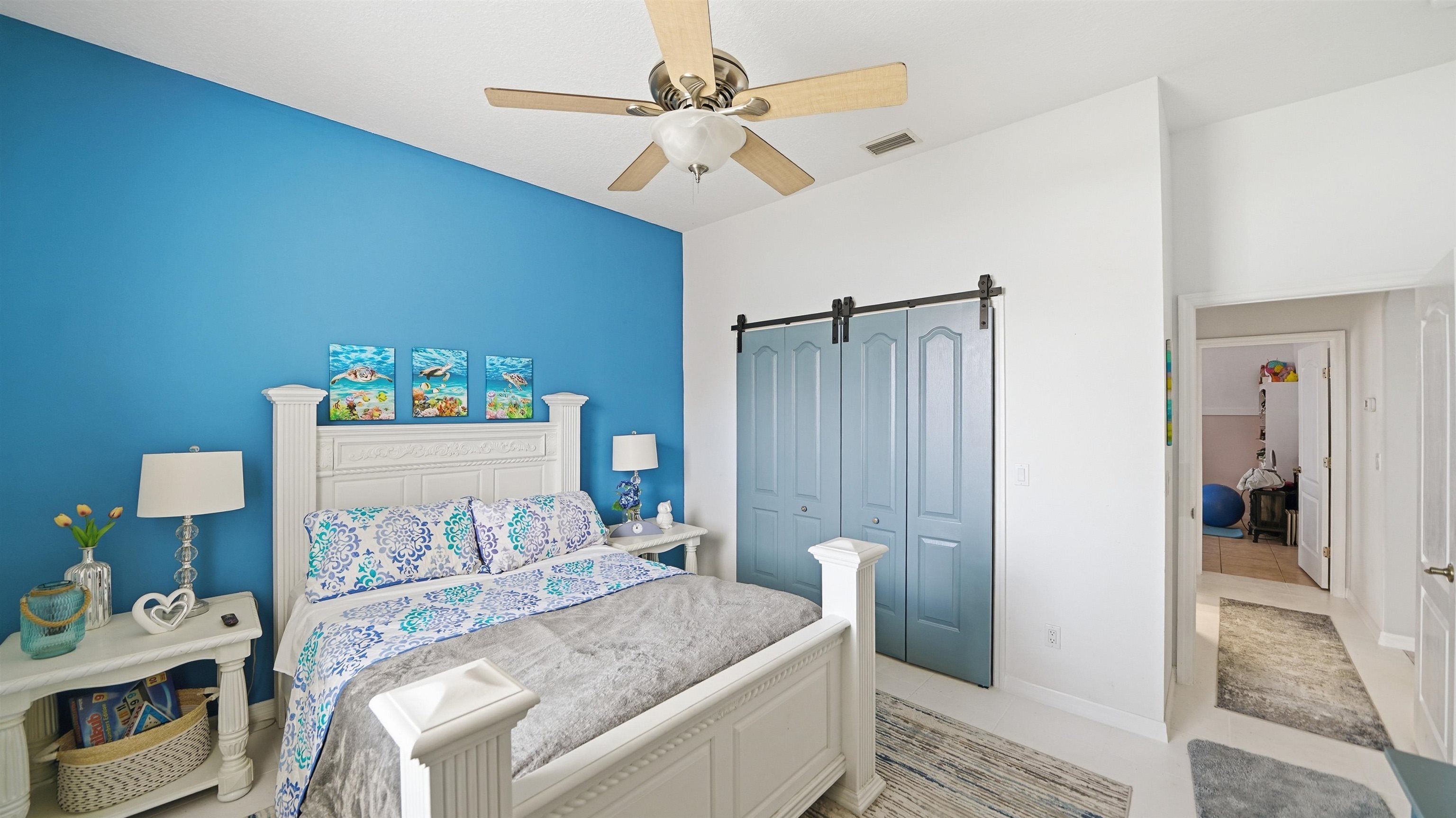22 Flanders Lane Palm Coast, FL 32137 - Photo 40 of 70 a bedroom with a bed and a chandelier