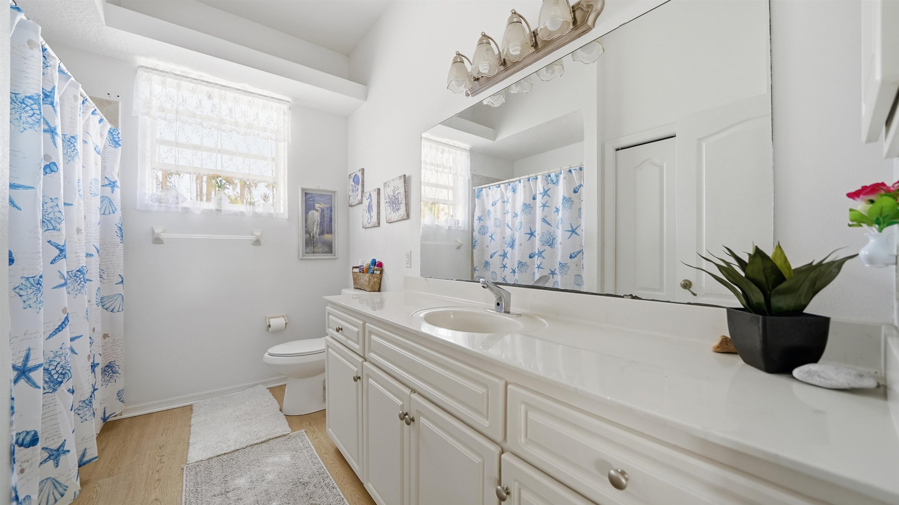 22 Flanders Lane Palm Coast, FL 32137 - Photo 41 of 70 a bathroom with a sink a toilet and a shower