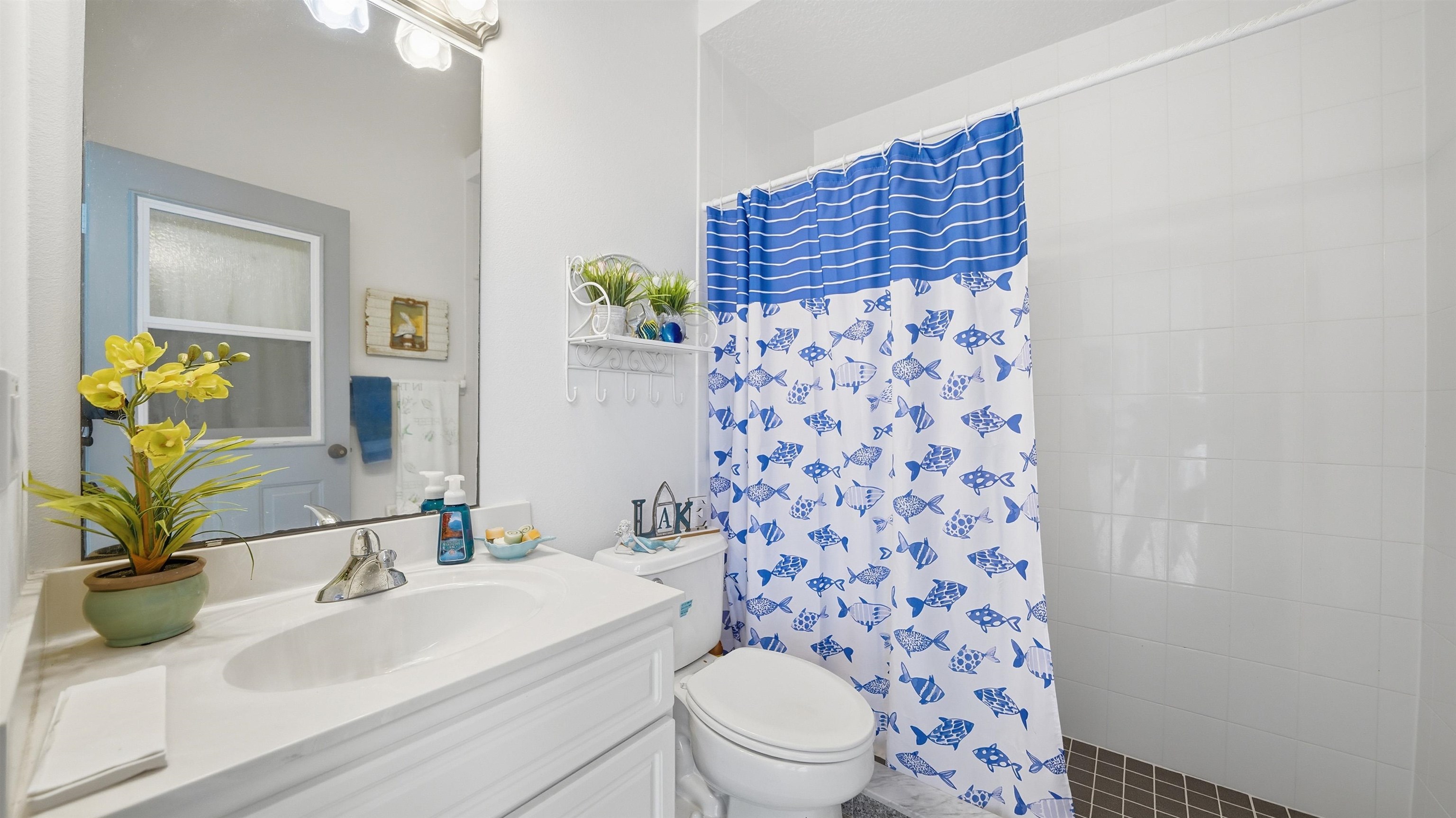 22 Flanders Lane Palm Coast, FL 32137 - Photo 47 of 70 a bathroom with a sink toilet and shower