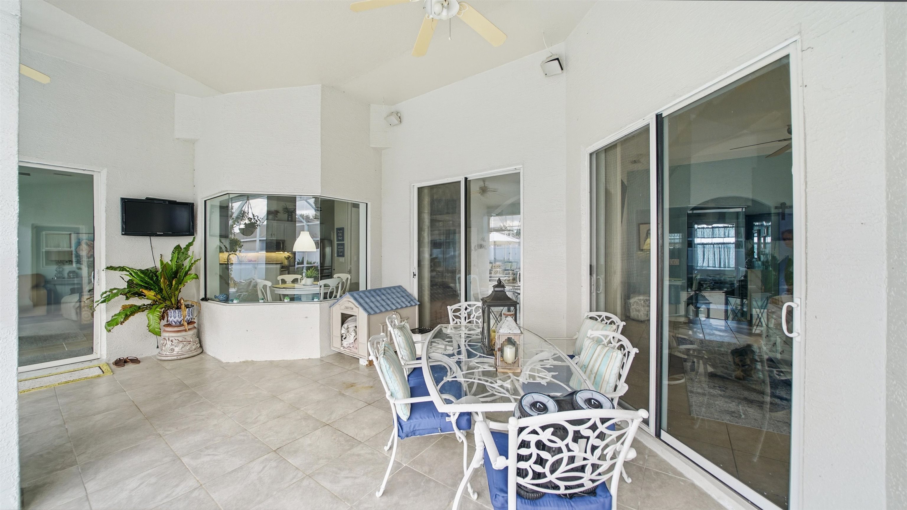 22 Flanders Lane Palm Coast, FL 32137 - Photo 50 of 70 Sunroom with a ceiling fan and a patio