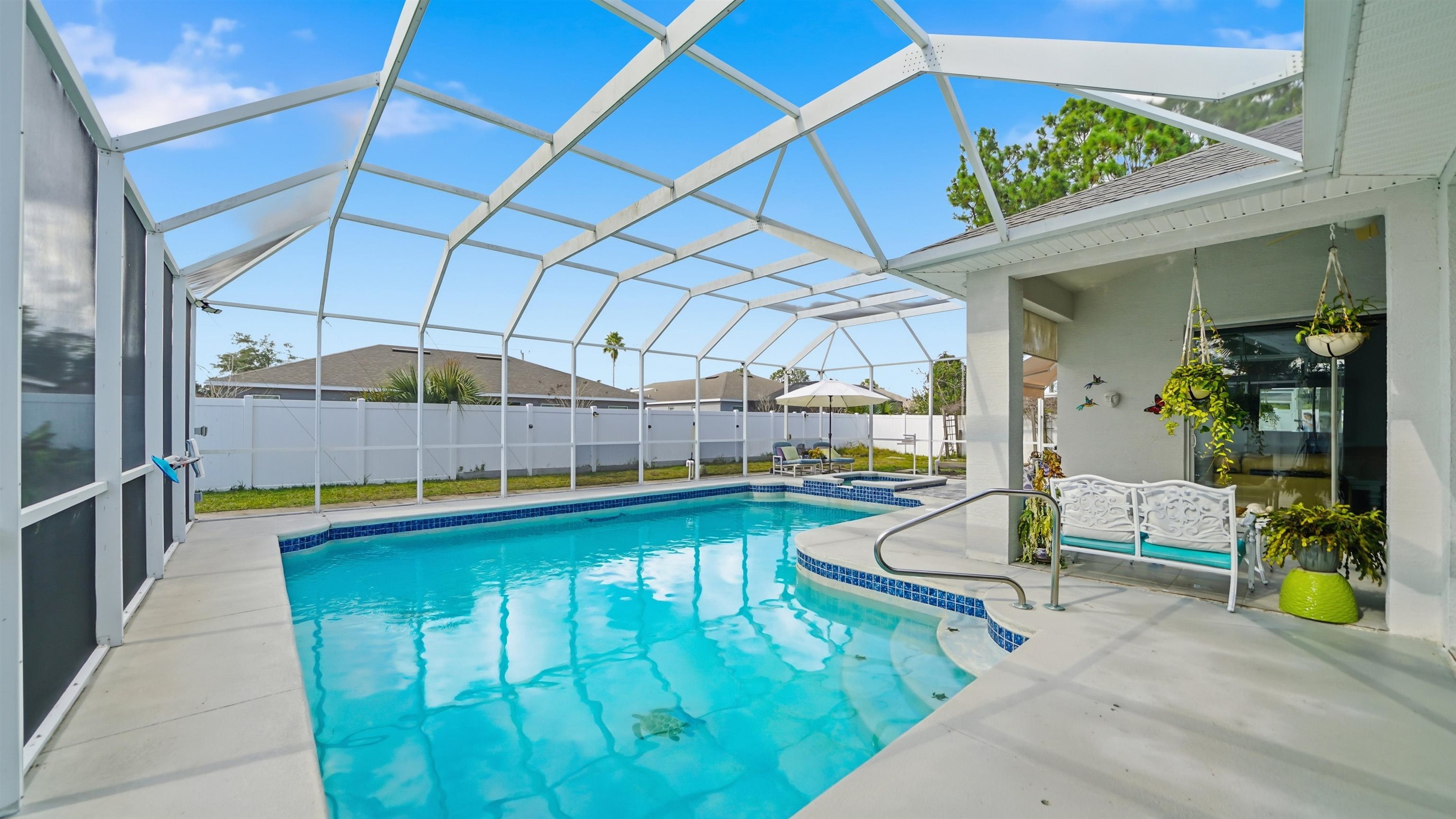 22 Flanders Lane Palm Coast, FL 32137 - Photo 51 of 70 a swimming pool with outdoor seating