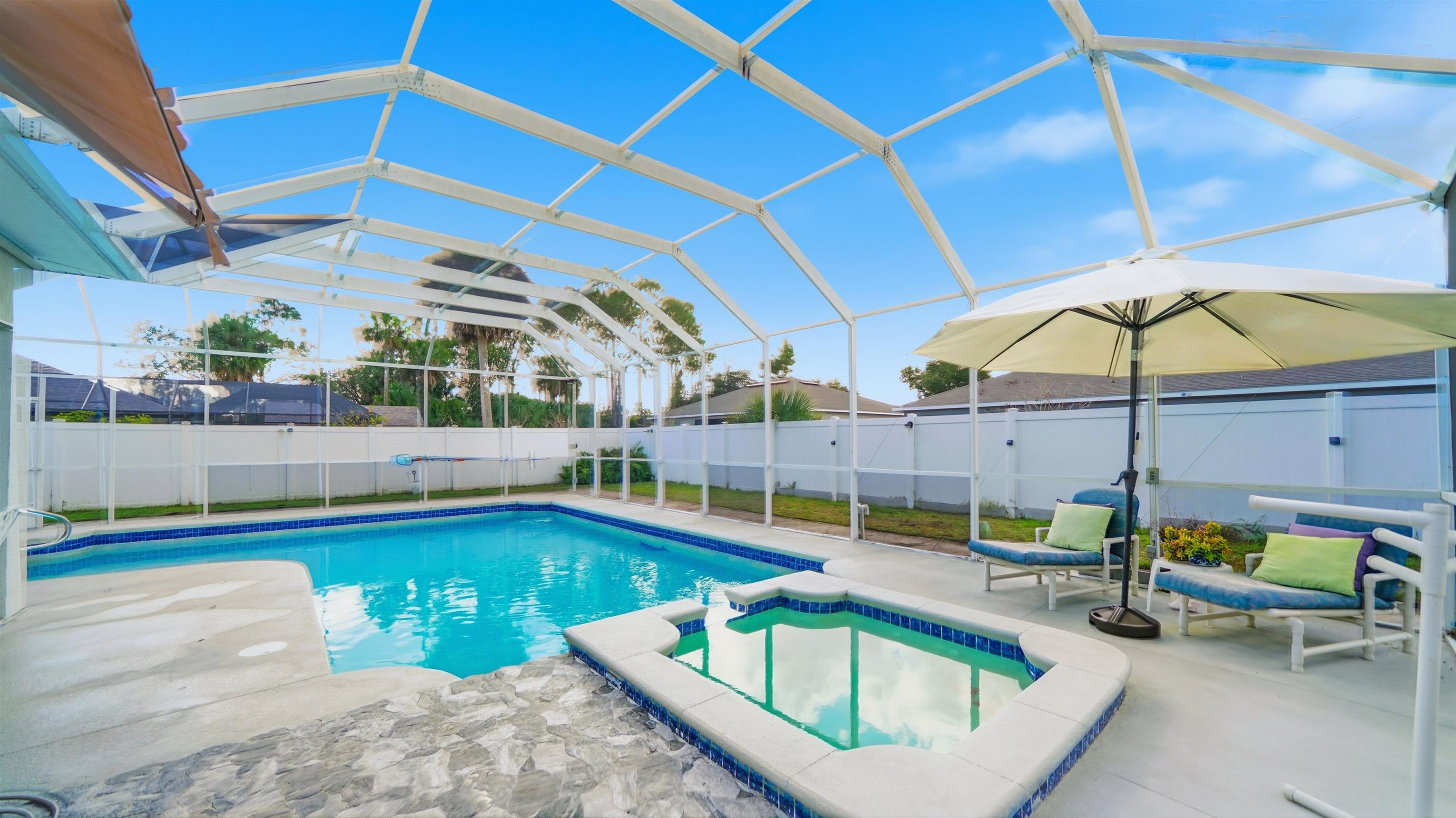 22 Flanders Lane Palm Coast, FL 32137 - Photo 53 of 70 a view of a swimming pool with a lounge chairs