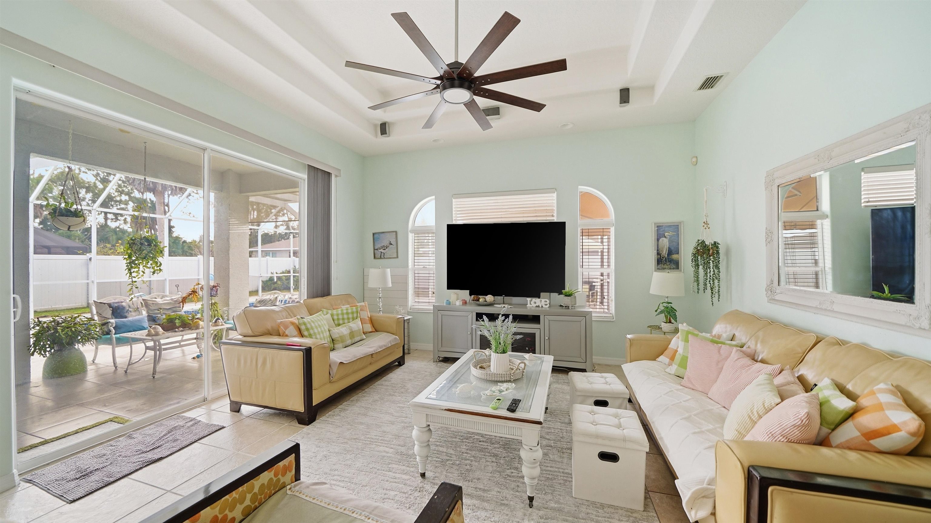 22 Flanders Lane Palm Coast, FL 32137 - Photo 6 of 70 a living room with furniture a flat screen tv and a large window