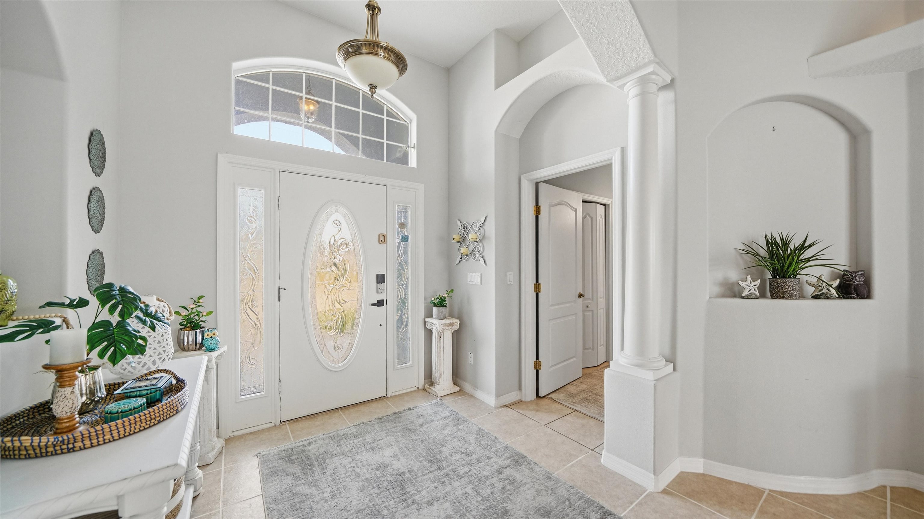 22 Flanders Lane Palm Coast, FL 32137 - Photo 10 of 70 a view of an entryway with wooden floor